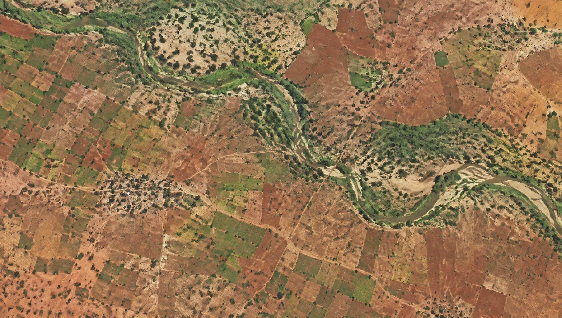 Aerial view of agricultural fields and river channels in the Sahel